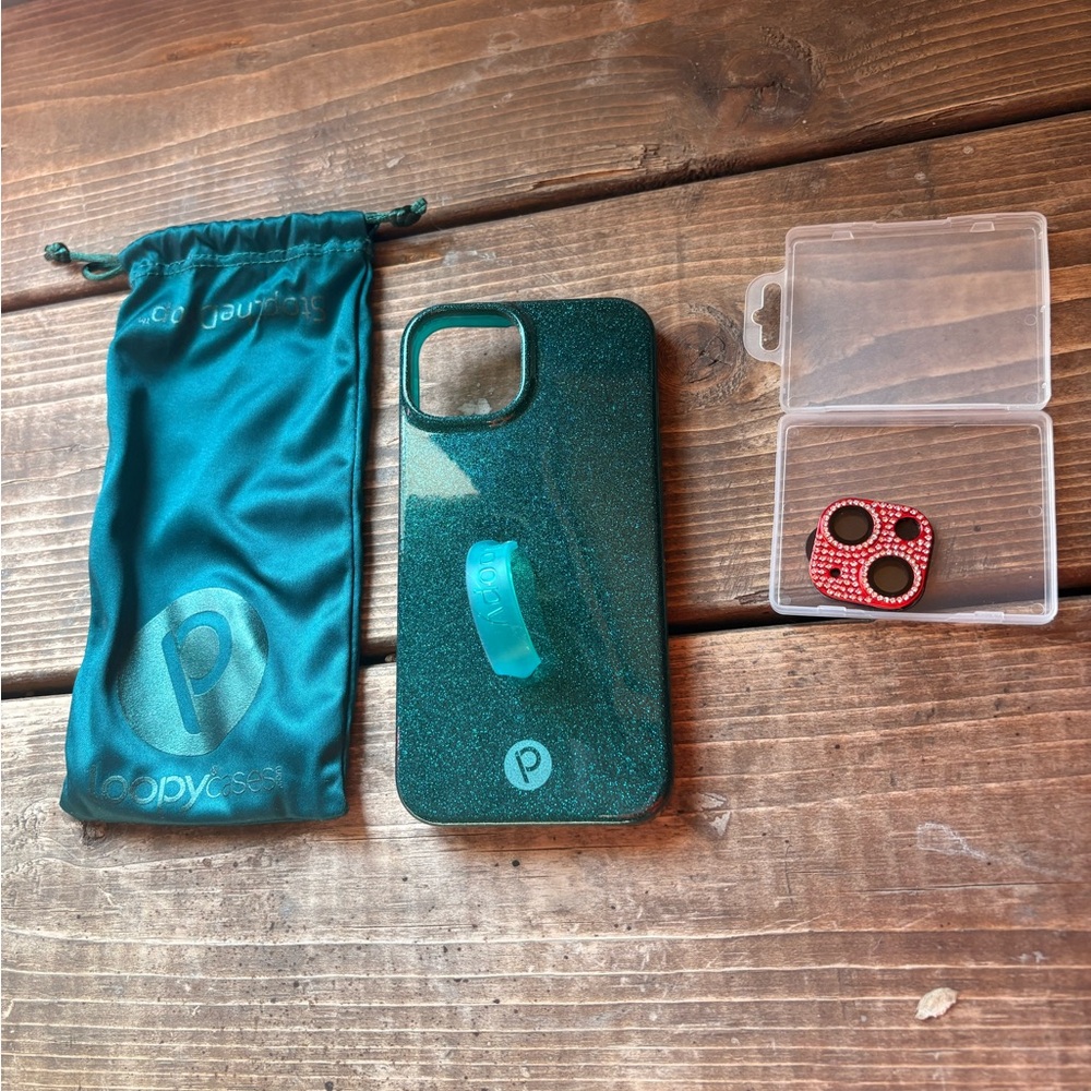 Teal Glitter Loopy Case with Red rhinestone camera cover. iPhone 13/14